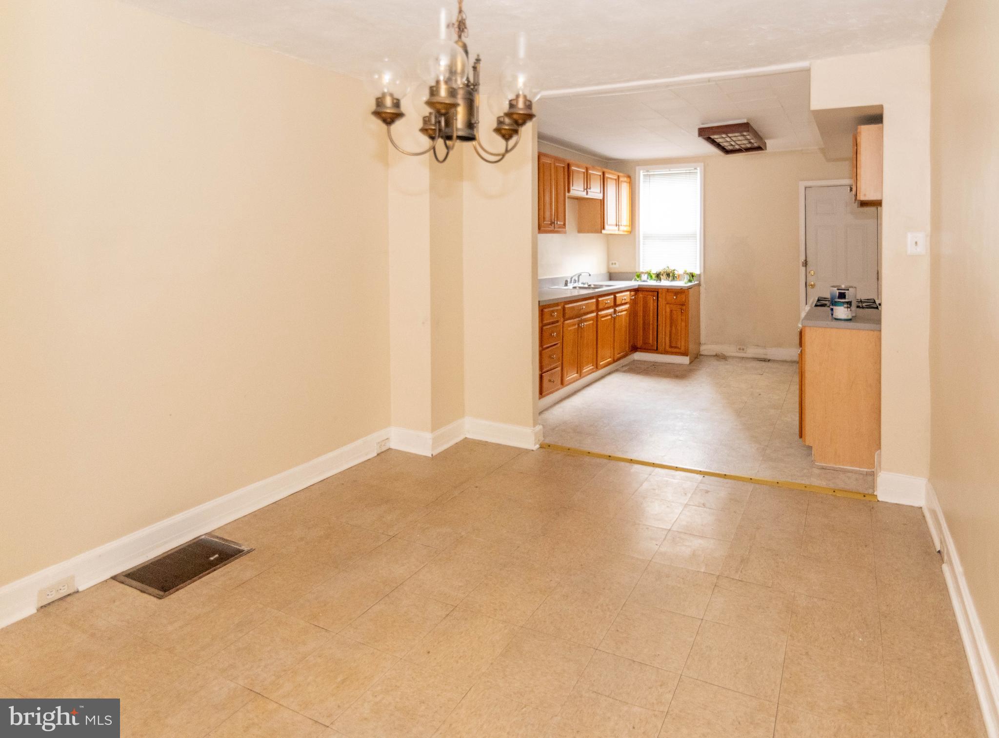 1622 Patapsco Street Baltimore, MD 21230 - Photo 6 of 30 a view of a kitchen with a sink and a refrigerator