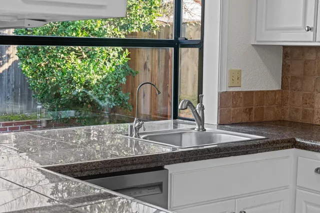 a kitchen with a sink and a window