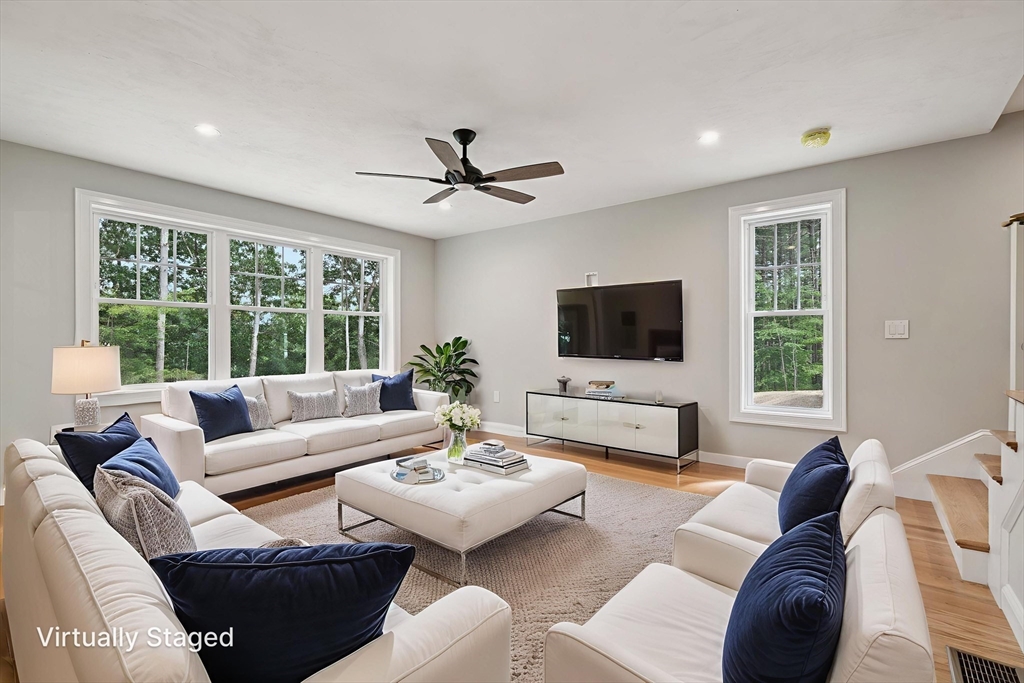 27 James Road, Unit 1 Upton, MA 01568 - Photo 11 of 41 a living room with furniture a flat screen tv and a large window