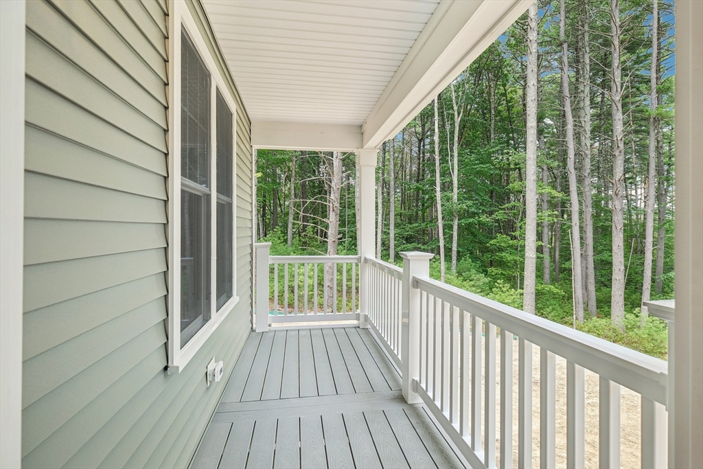 27 James Road, Unit 1 Upton, MA 01568 - Photo 14 of 41 a view of a room with wooden floor and wooden walls