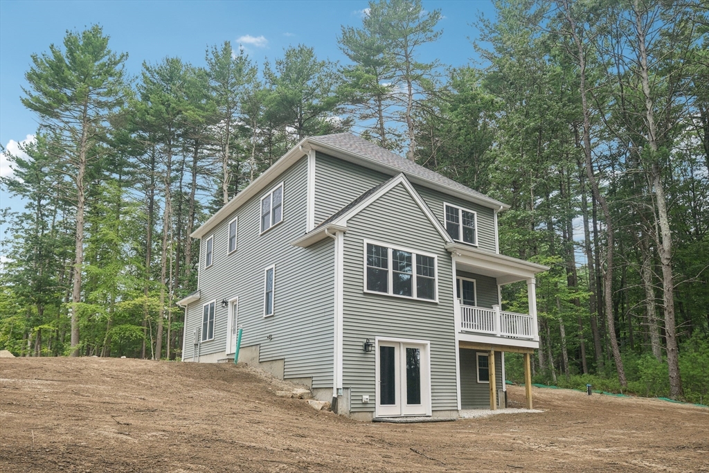 27 James Road, Unit 1 Upton, MA 01568 - Photo 15 of 41 a view of a house with a yard