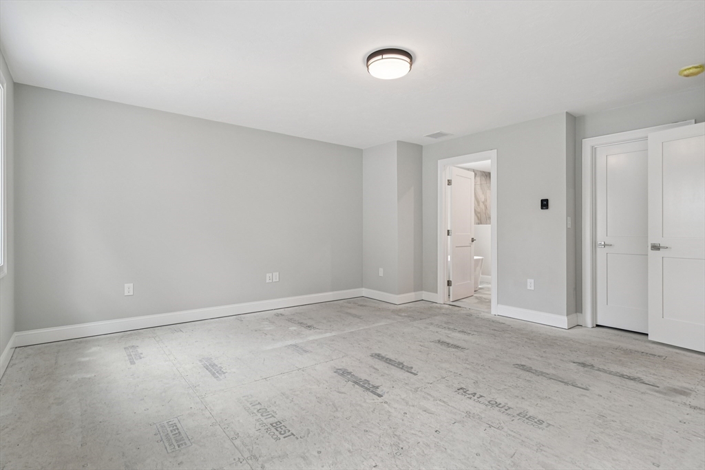 27 James Road, Unit 1 Upton, MA 01568 - Photo 16 of 41 an empty room with an entryway