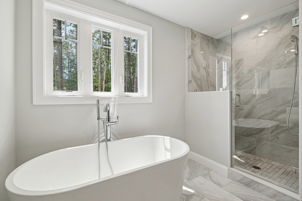 27 James Road, Unit 1 Upton, MA 01568 - Photo 20 of 41 a white bath tub sitting next to a shower
