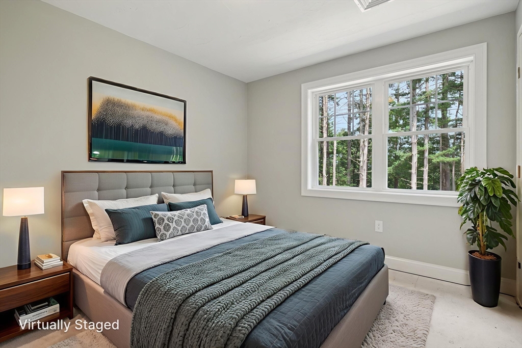 27 James Road, Unit 1 Upton, MA 01568 - Photo 21 of 41 a bedroom with a bed and a painting on the wall