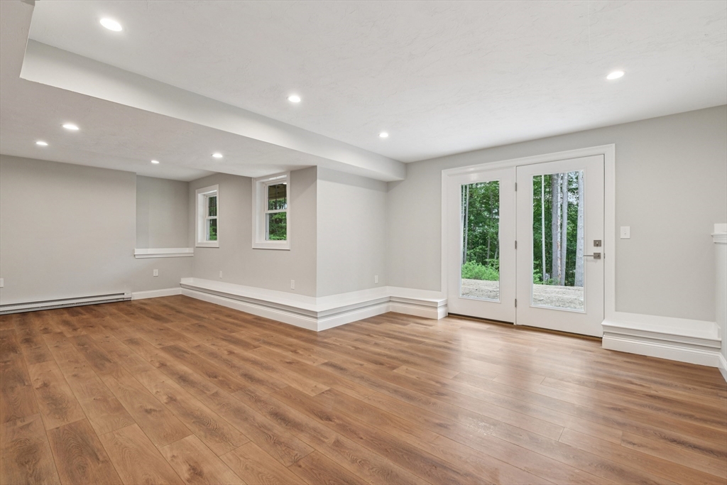 27 James Road, Unit 1 Upton, MA 01568 - Photo 24 of 41 an empty room with wooden floor and windows