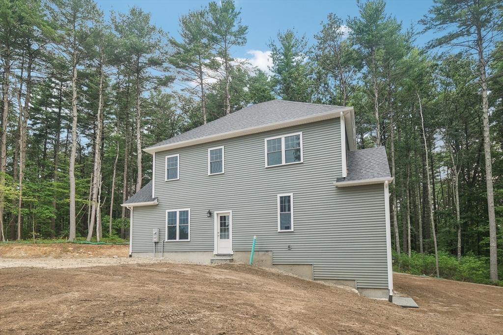 27 James Road, Unit 1 Upton, MA 01568 - Photo 28 of 41 a front view of a house with a garden