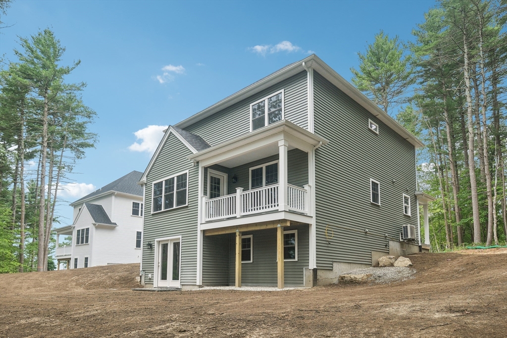 27 James Road, Unit 1 Upton, MA 01568 - Photo 29 of 41 a front view of a house with a yard