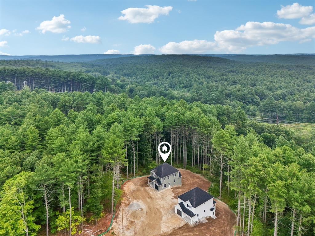 27 James Road, Unit 1 Upton, MA 01568 - Photo 30 of 41 a view of a lake in middle of forest