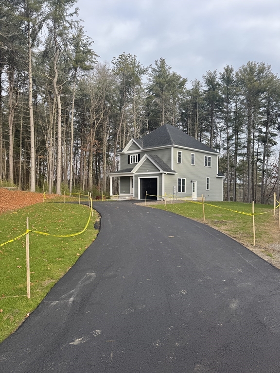 27 James Road, Unit 1 Upton, MA 01568 - Photo 3 of 41 a view of a house with a big yard and large trees