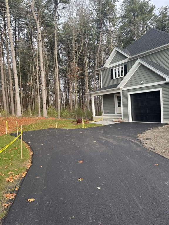27 James Road, Unit 1 Upton, MA 01568 - Photo 4 of 41 a front view of a house with a yard