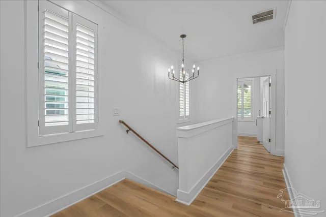 a view of a hallway with windows