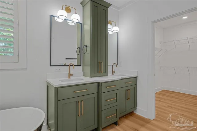 a bathroom with a double vanity sink and a mirror