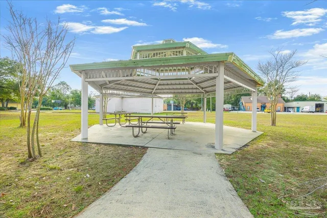 a view of a swimming pool with an outdoor seating