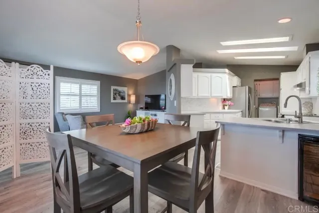 a kitchen with a table and chairs in it