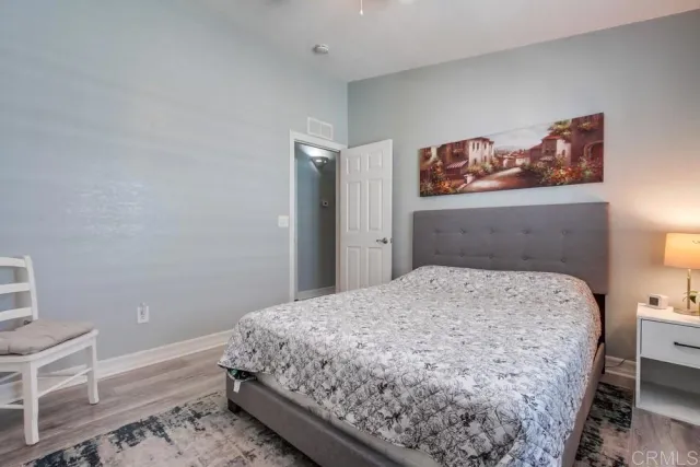 a bedroom with a bed and cabinets