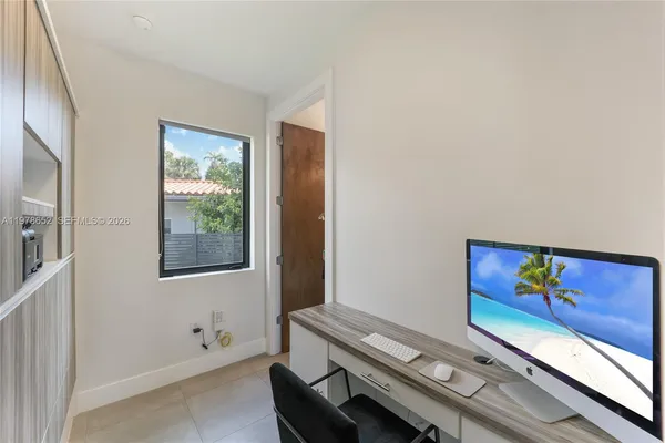 a room with furniture and painting on the wall