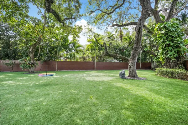 a view of backyard with green space