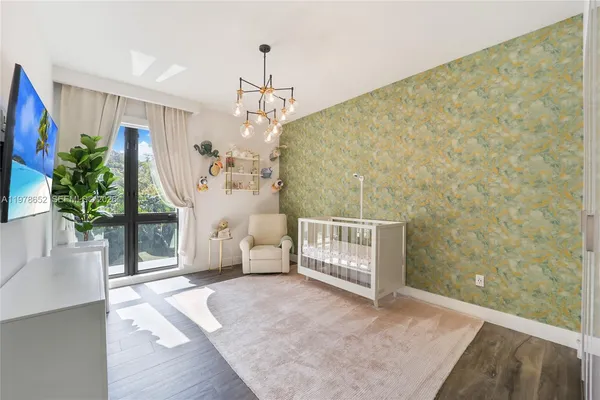 a view of livingroom with furniture and a potted plant