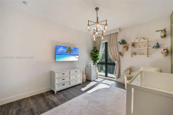 a view of a bedroom and a window