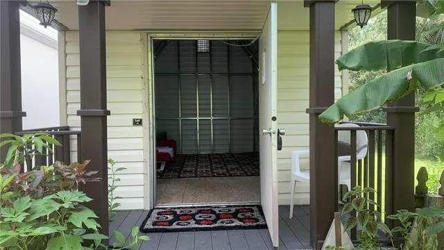 a bathroom with a sink a toilet a window and shower