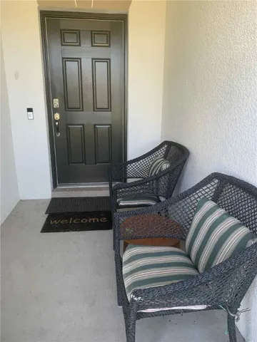 a bedroom with bed and wooden floor
