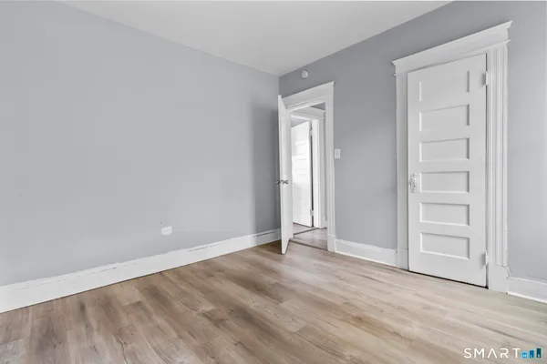 an empty room with wooden floor