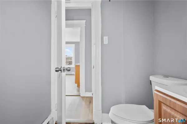 a white toilet sitting next to a bathroom sink