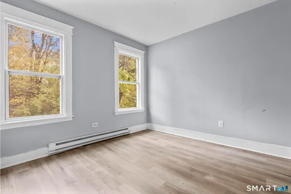 a view of an empty room with a window
