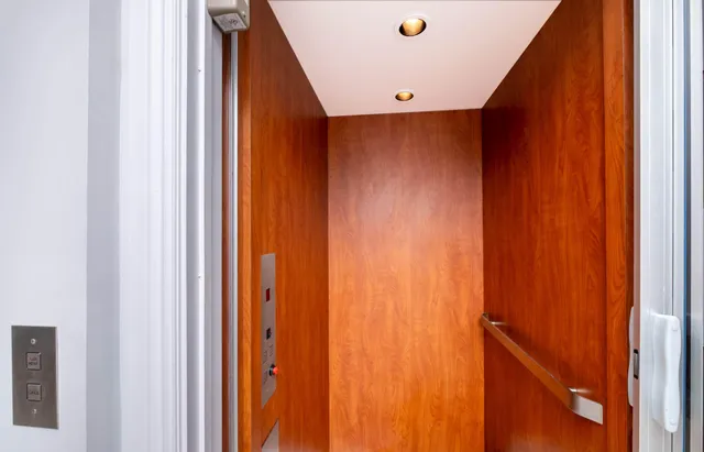 a view of entryway livingroom and hall with wooden floor