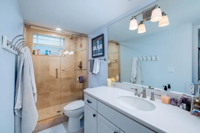 a kitchen with a refrigerator and a stove