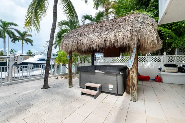 a view of a chairs and table in backyard