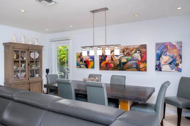 a living room with furniture a couch and a window