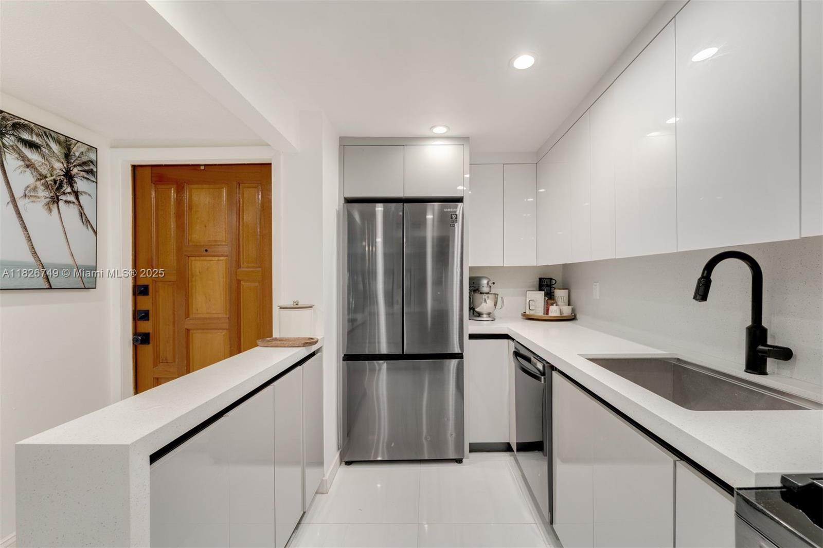 3214 West Trade Avenue, Unit III5 Miami, FL 33133 - Photo 1 of 31 a kitchen with stainless steel appliances granite countertop a refrigerator and a sink