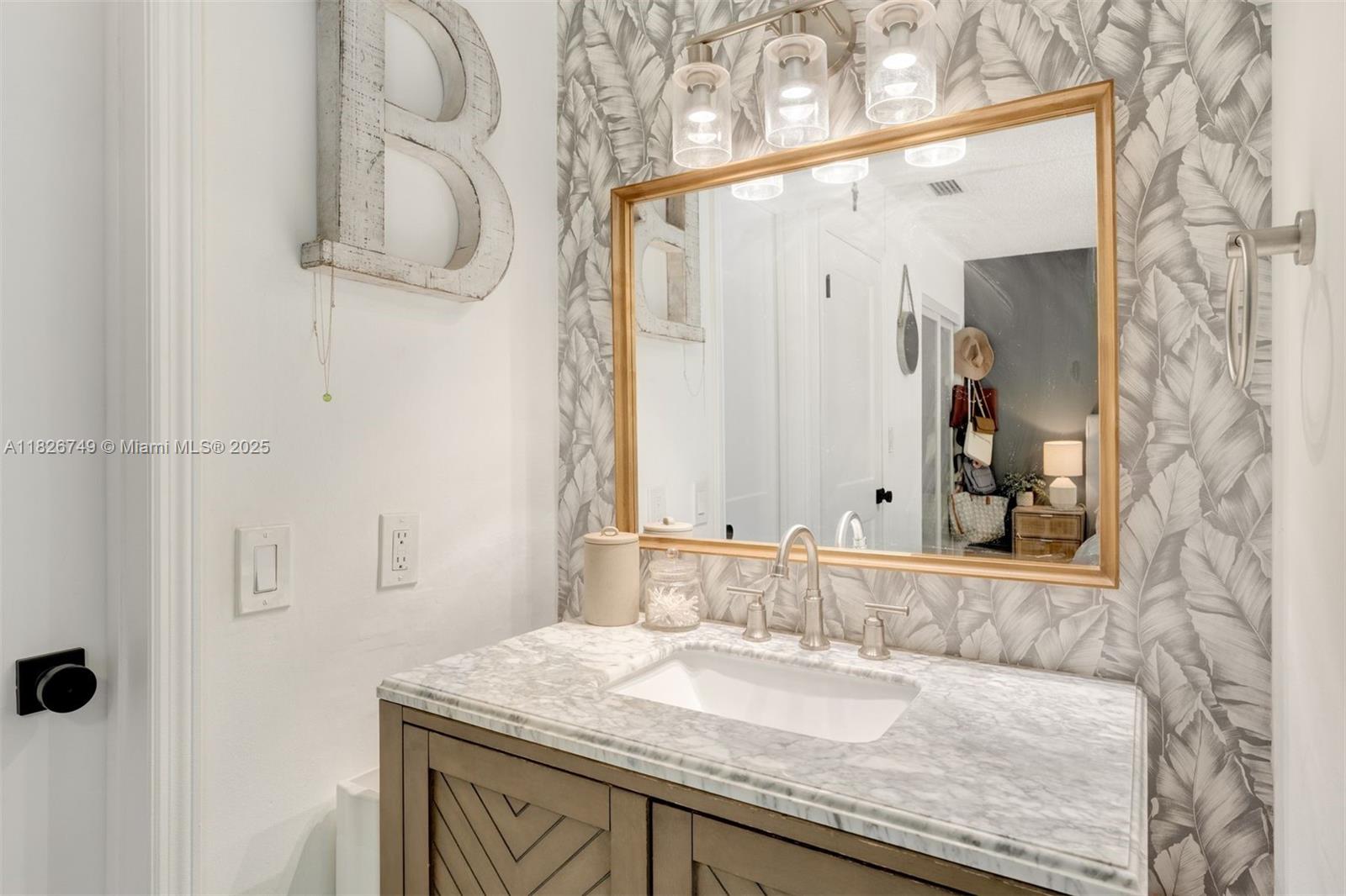 3214 West Trade Avenue, Unit III5 Miami, FL 33133 - Photo 14 of 31 a bathroom with a granite countertop sink and a mirror