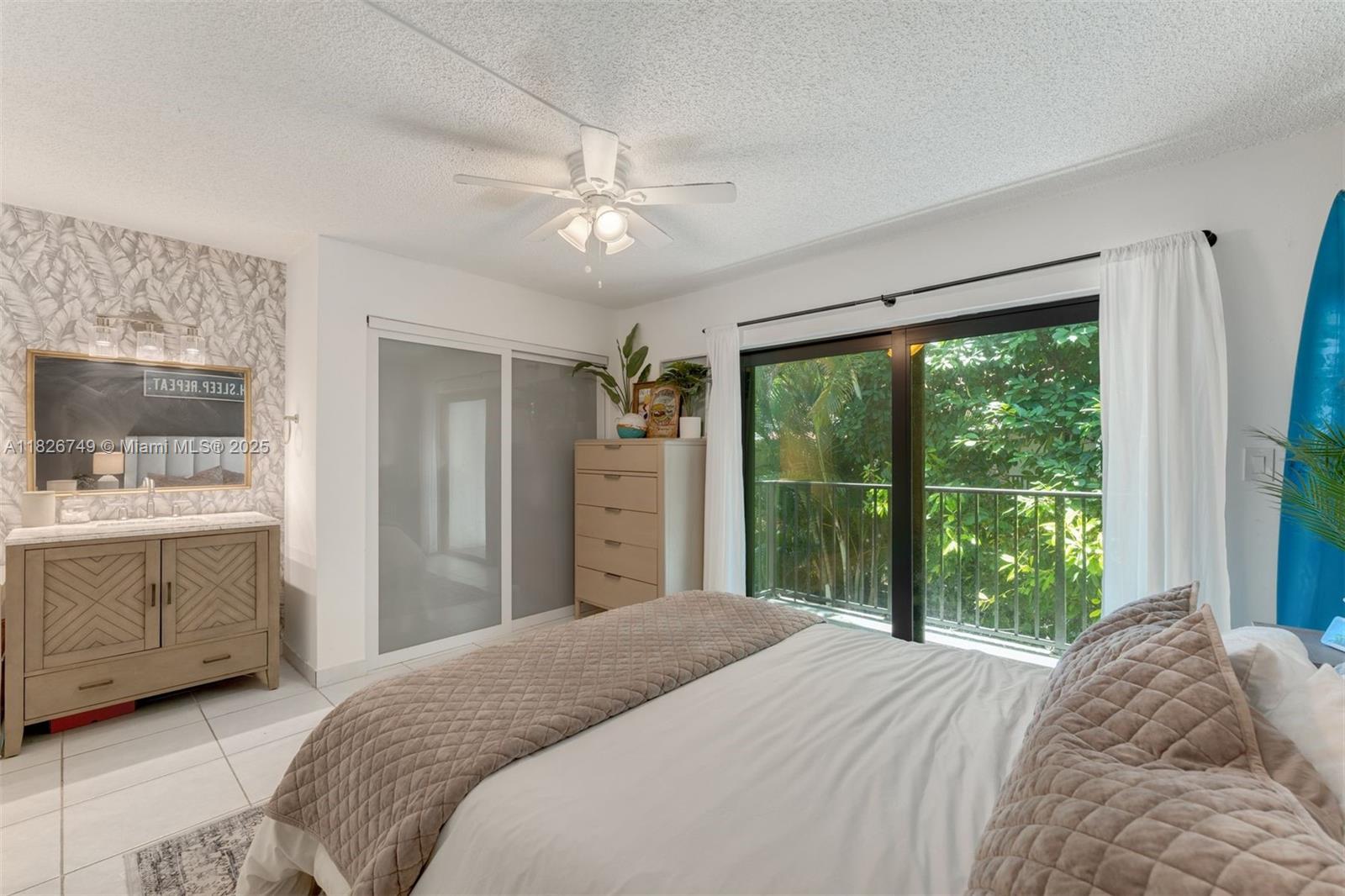 3214 West Trade Avenue, Unit III5 Miami, FL 33133 - Photo 16 of 31 a bedroom with a large bed and a window