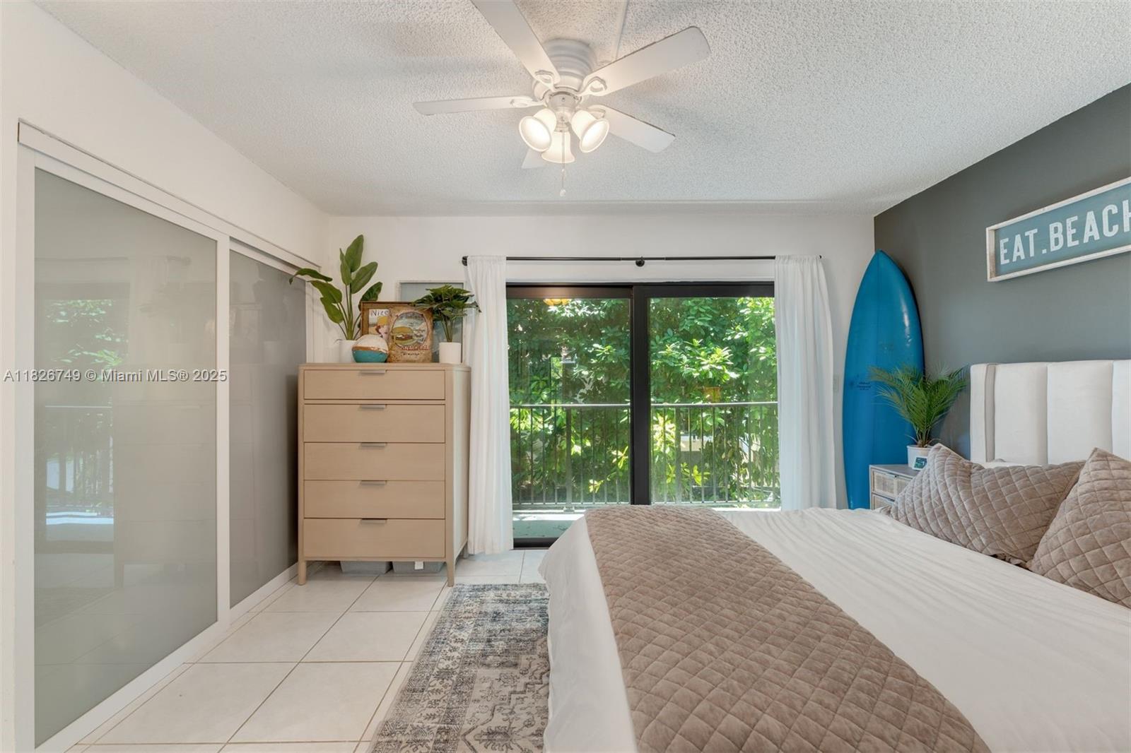 3214 West Trade Avenue, Unit III5 Miami, FL 33133 - Photo 17 of 31 a bed room with a bed and a window