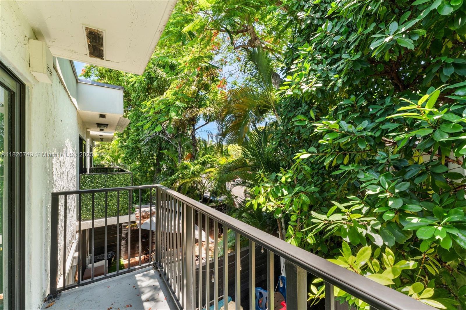 3214 West Trade Avenue, Unit III5 Miami, FL 33133 - Photo 18 of 31 a view of a balcony with an outdoor space