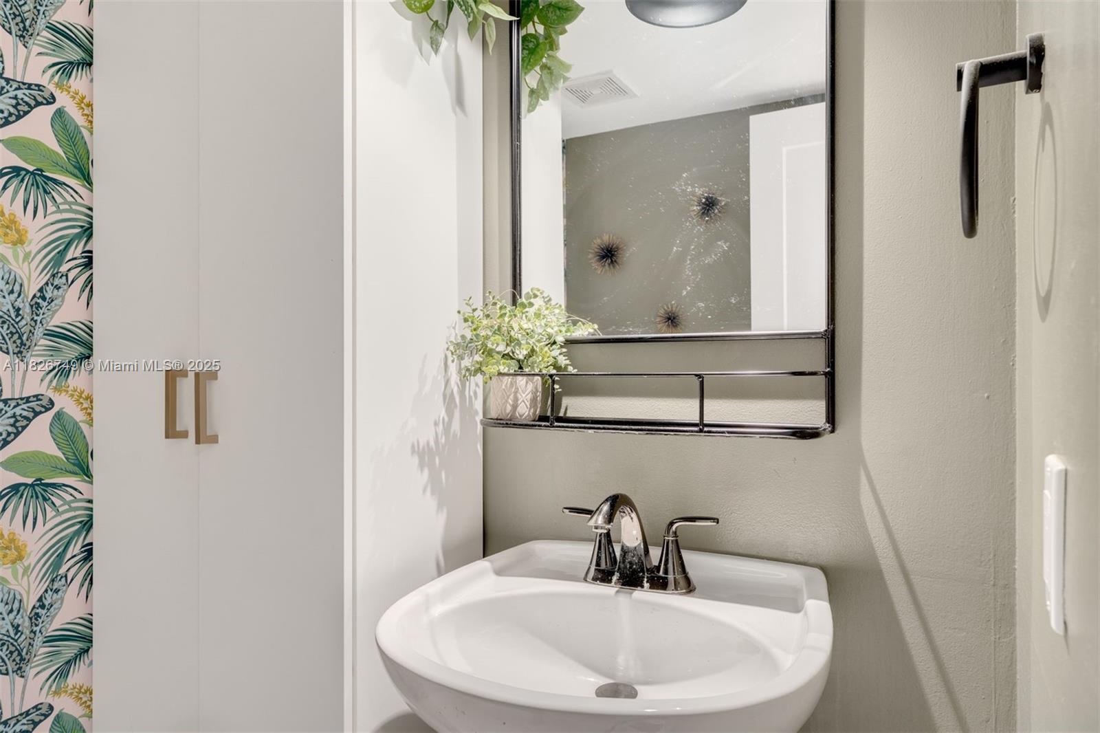 3214 West Trade Avenue, Unit III5 Miami, FL 33133 - Photo 26 of 31 a bathroom with a sink and mirror