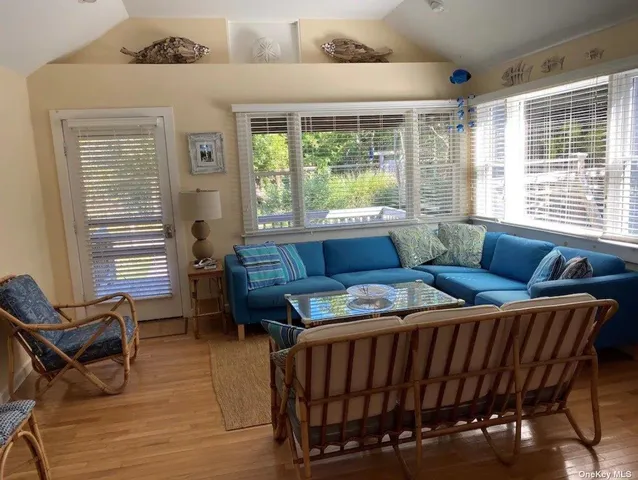 a living room with furniture and a window