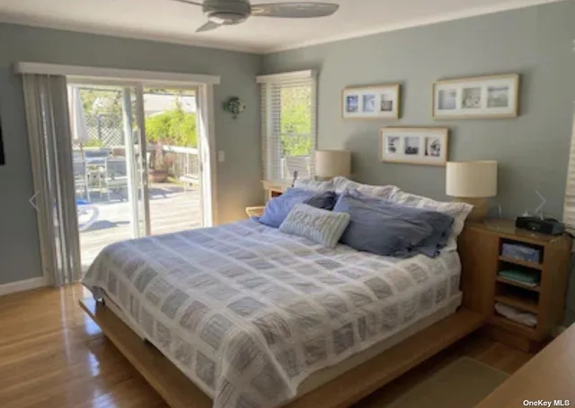 a large bed sitting in a bedroom next to a window