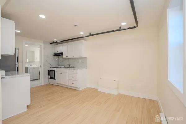 a view of a kitchen with electric appliances