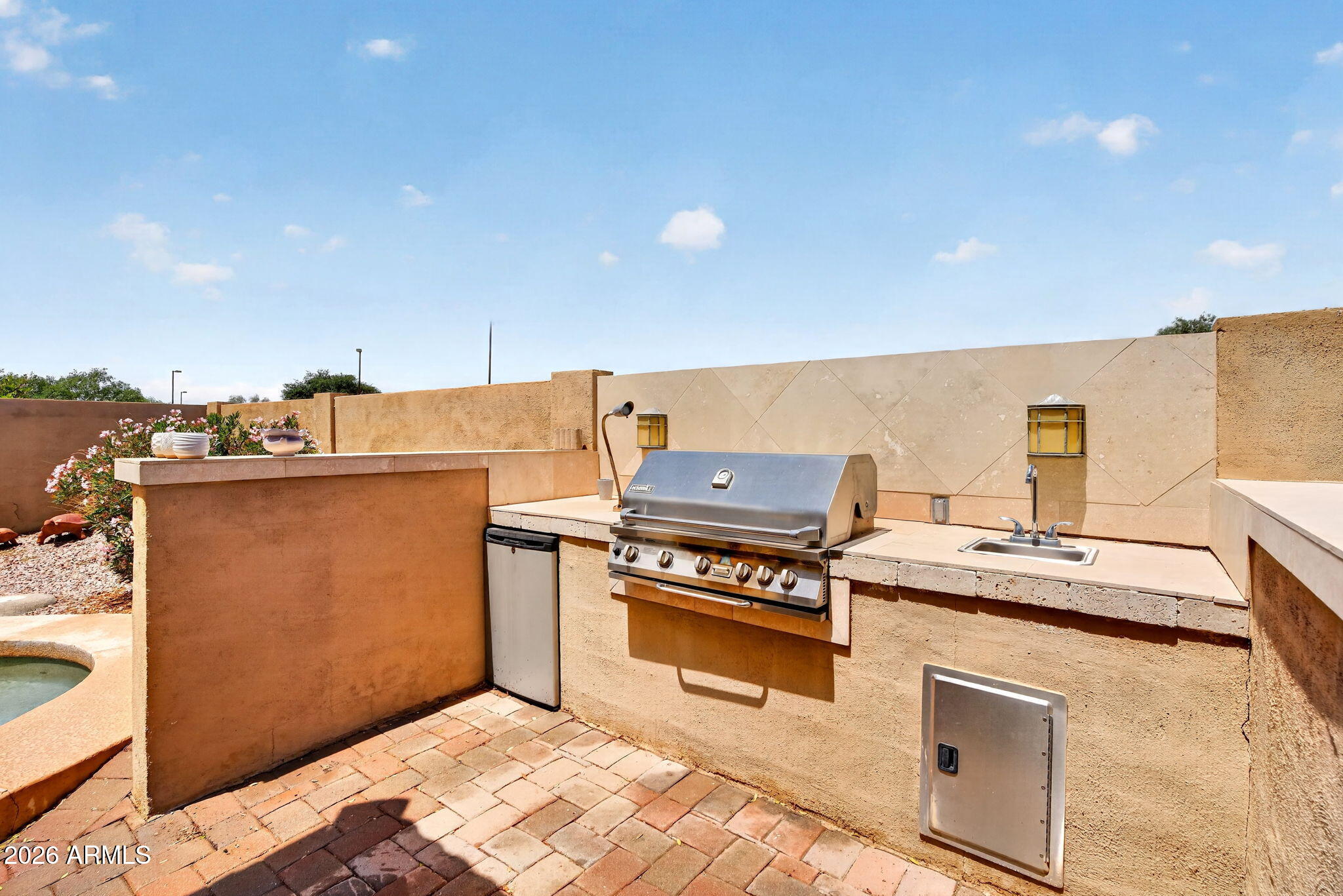 6280 South Sinova Court Gilbert, AZ 85298 - Photo 57 of 64 a kitchen with a stove and a microwave