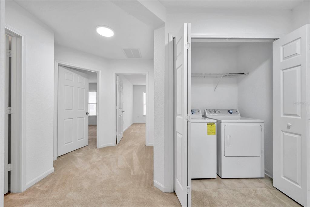 8206 Bally Money Road Tampa, FL 33610 - Photo 18 of 43 a view of a storage & utility room with a window