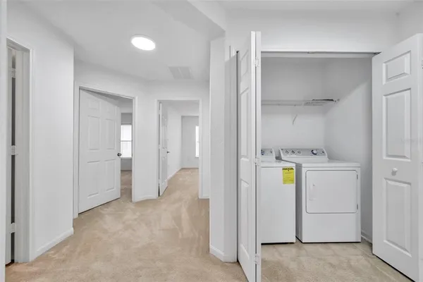 a view of a storage & utility room with a window