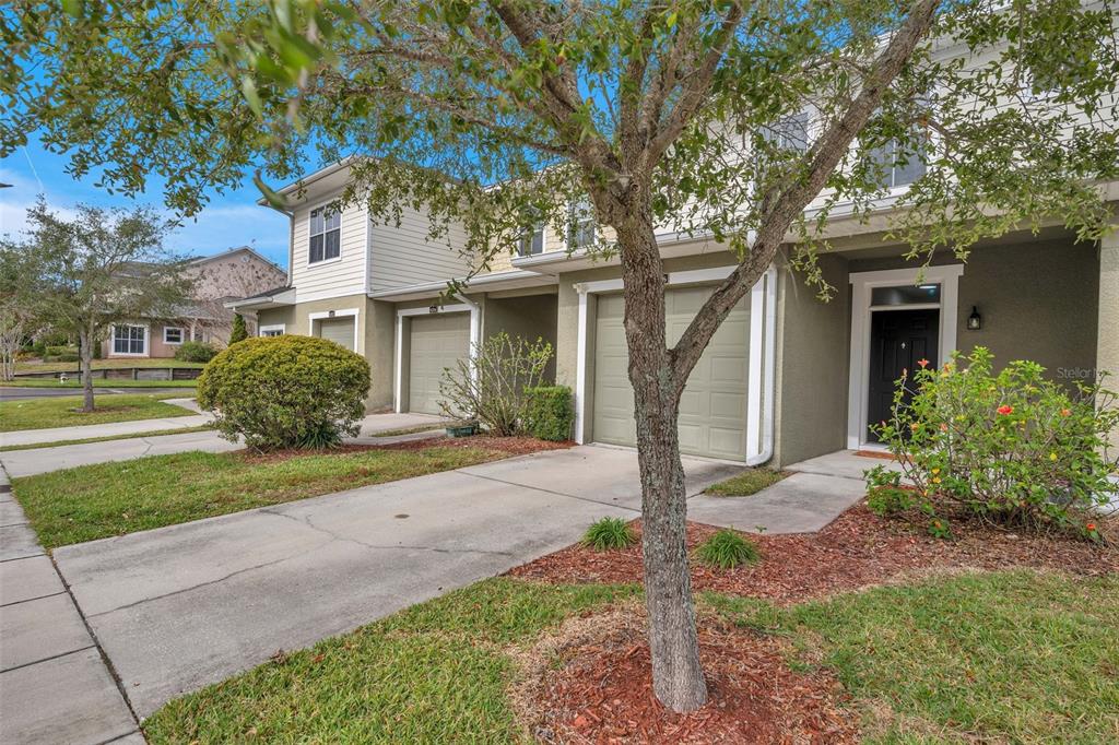 8206 Bally Money Road Tampa, FL 33610 - Photo 2 of 43 a front view of a house with garden