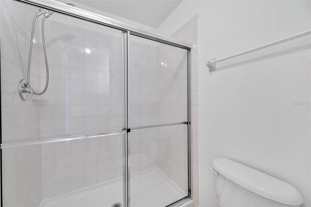 8206 Bally Money Road Tampa, FL 33610 - Photo 24 of 43 a bathroom with a shower and toilet