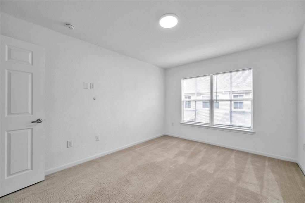 8206 Bally Money Road Tampa, FL 33610 - Photo 31 of 43 an empty room with a window