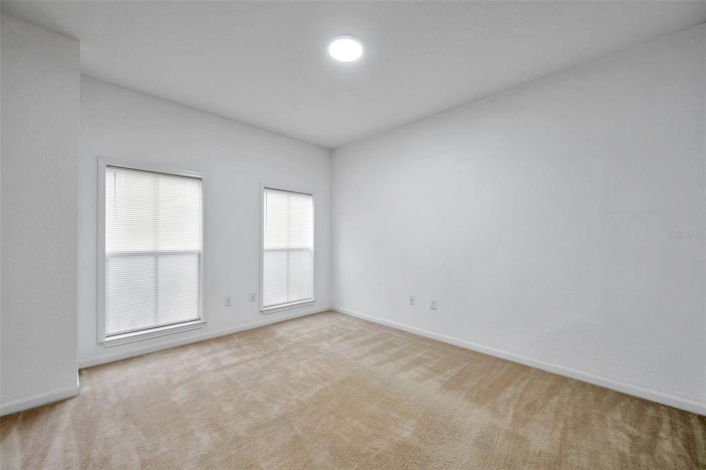 8206 Bally Money Road Tampa, FL 33610 - Photo 33 of 43 an empty room with windows and closet