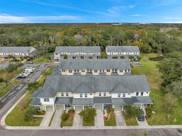 an aerial view of a house with outdoor space