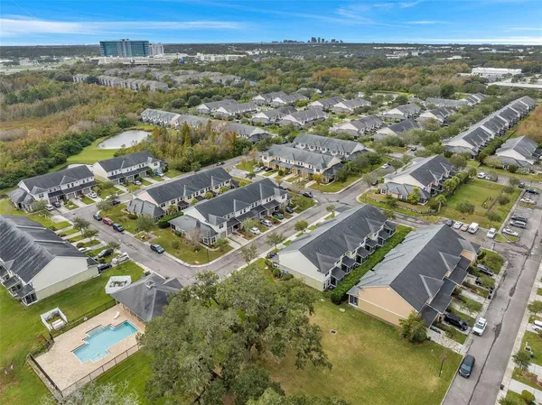 an aerial view of residential houses with outdoor space